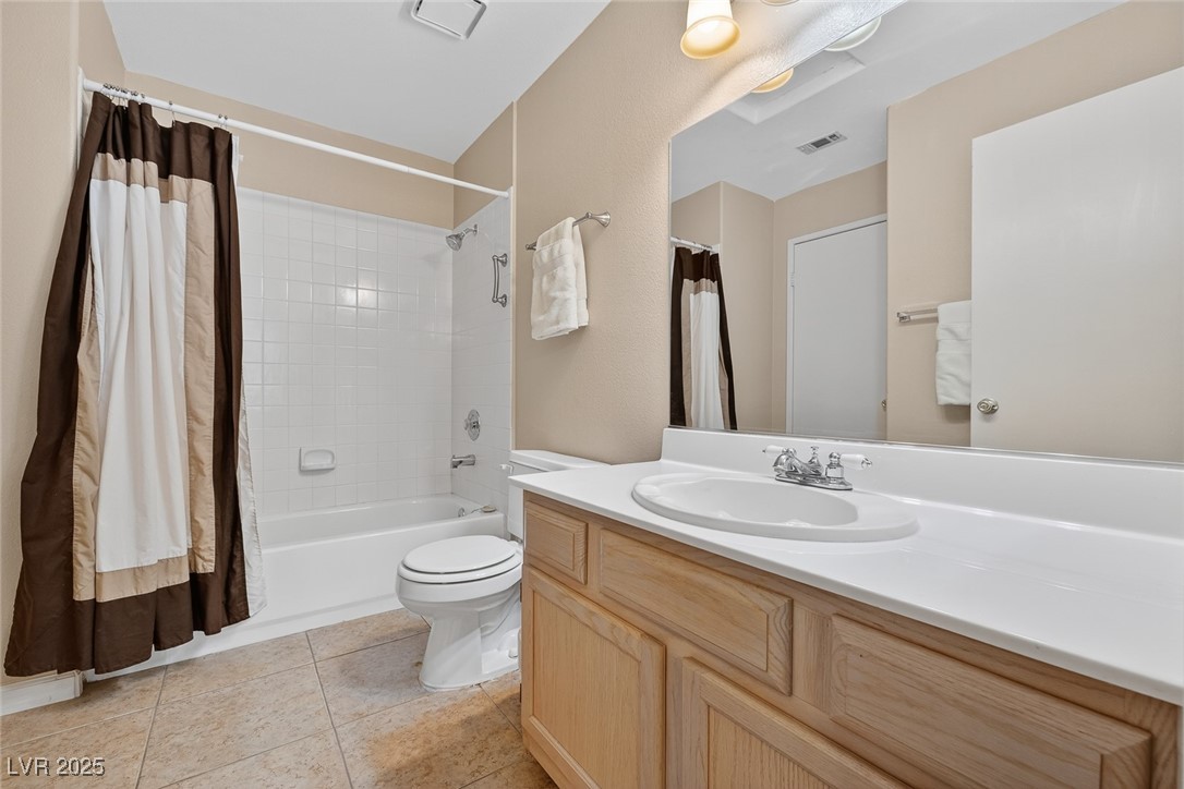 698 South Racetrack Road, Unit 1222 Henderson, NV 89015 - Photo 23 of 31 Full bathroom with shower / bathtub combination with curtain, vanity, and light tile patterned flooring
