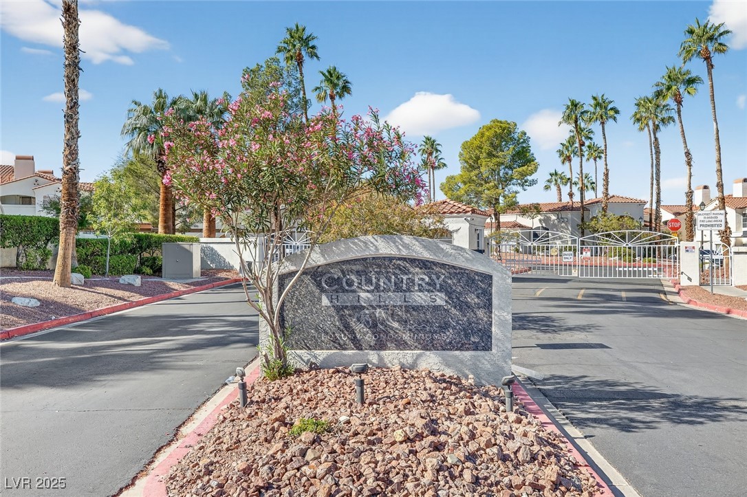 698 South Racetrack Road, Unit 1222 Henderson, NV 89015 - Photo 26 of 31 Community / neighborhood sign with a gate and a residential view