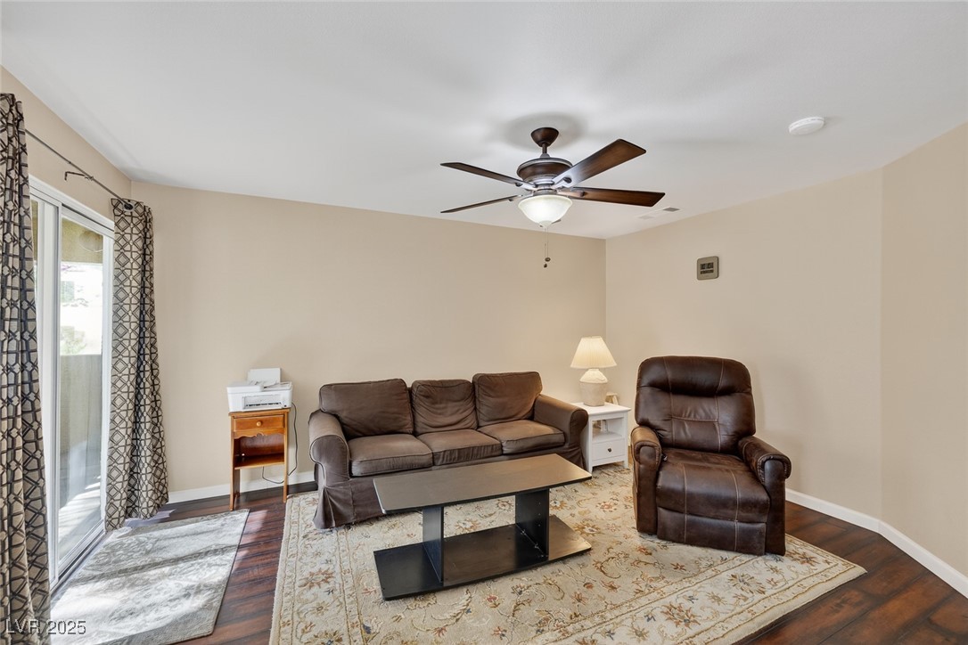 698 South Racetrack Road, Unit 1222 Henderson, NV 89015 - Photo 8 of 31 Living room with dark wood-style flooring and ceiling fan