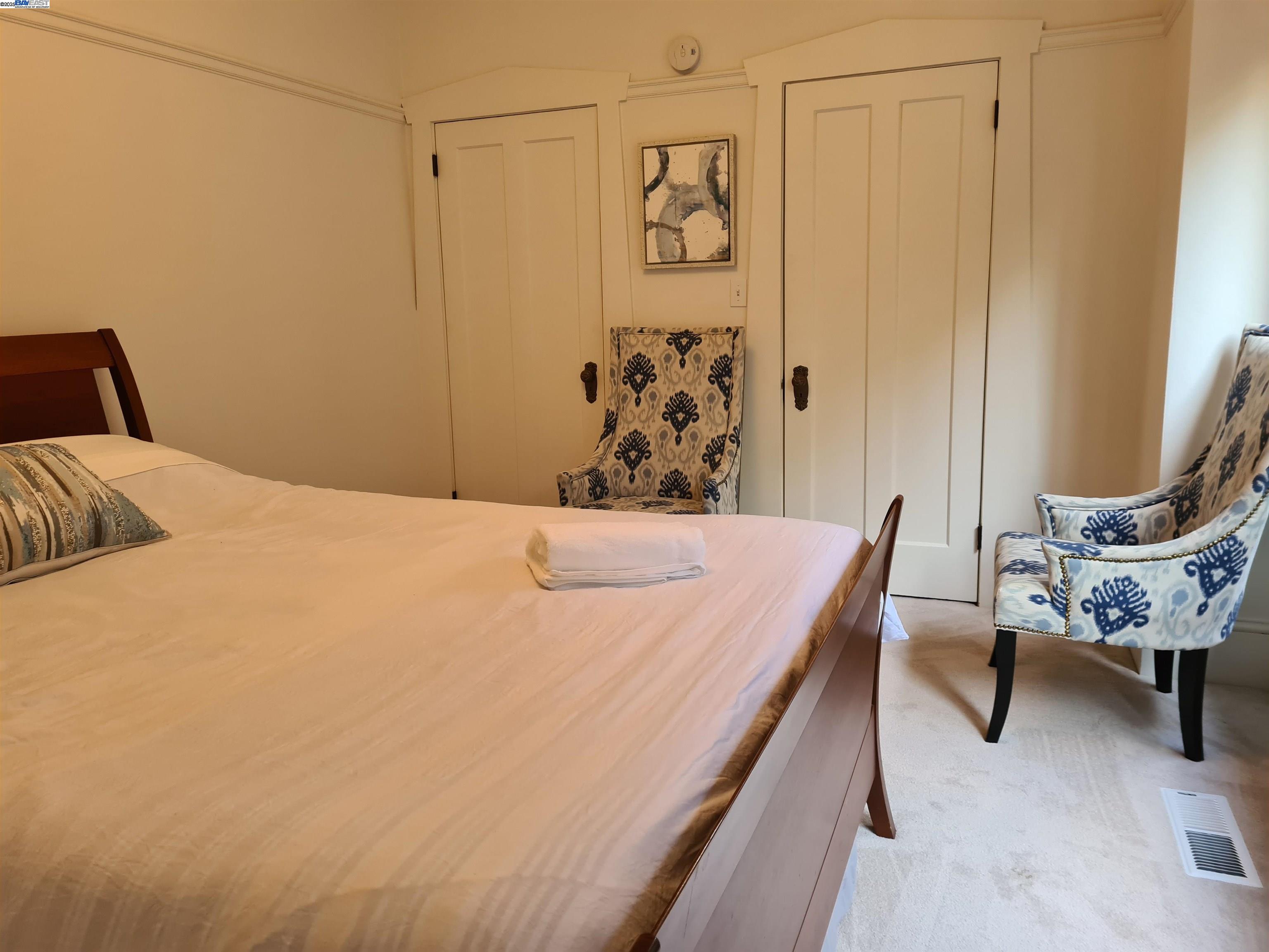 3103 Central Alameda, CA 94501 - Photo 13 of 50 a bedroom with a bed and a chair