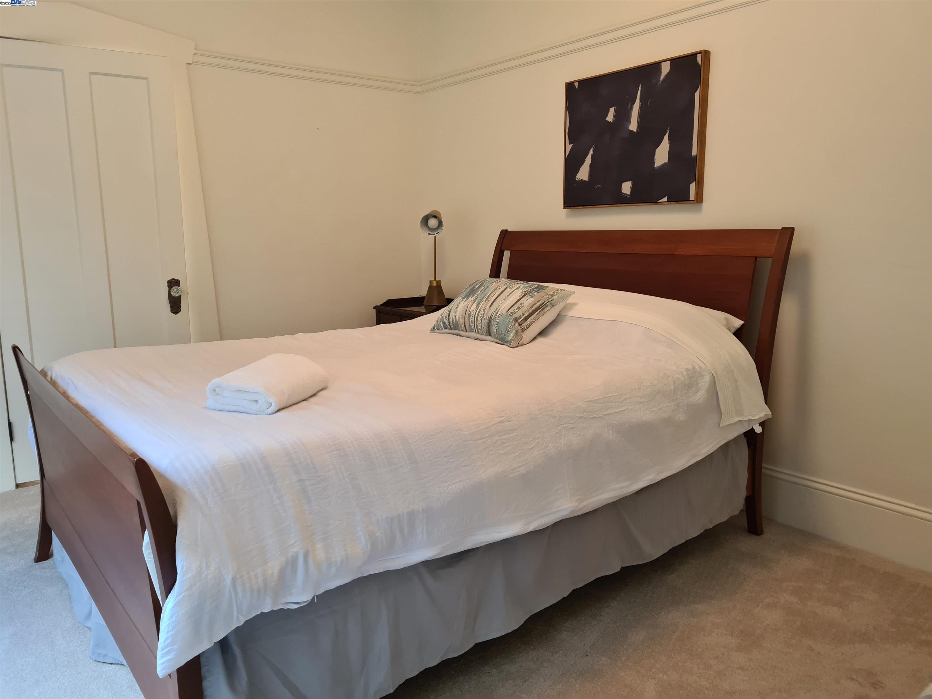 3103 Central Alameda, CA 94501 - Photo 15 of 50 a bedroom with a bed and painting on the wall