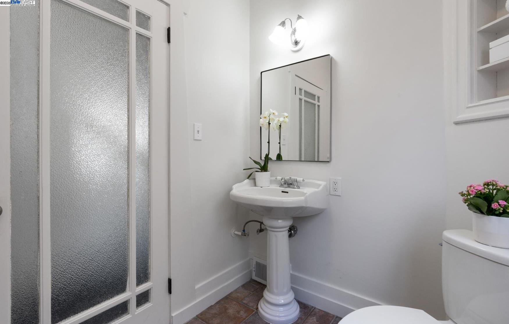 3103 Central Alameda, CA 94501 - Photo 23 of 50 a bathroom with a sink a mirror and toilet