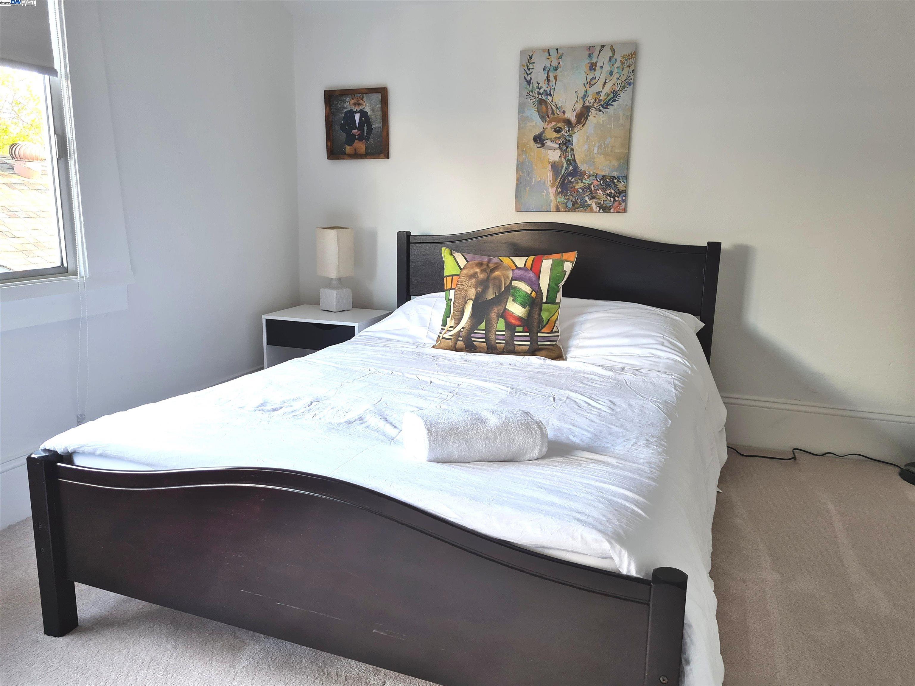 3103 Central Alameda, CA 94501 - Photo 28 of 50 a bedroom with a bed and a window