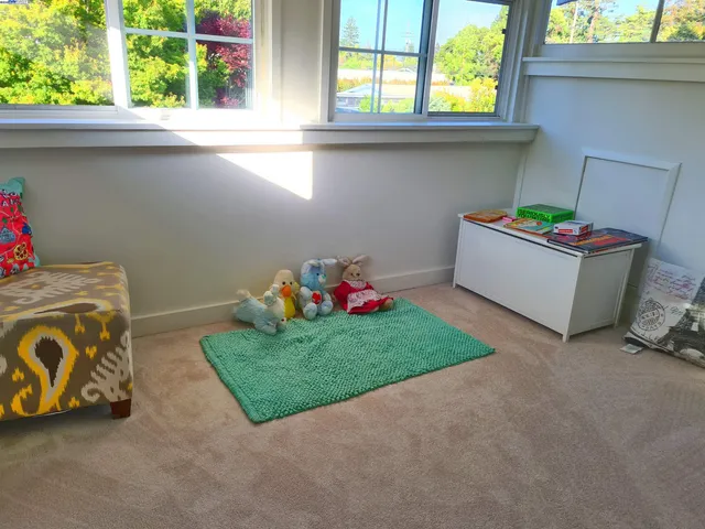 a bedroom with a bed and a cabinet