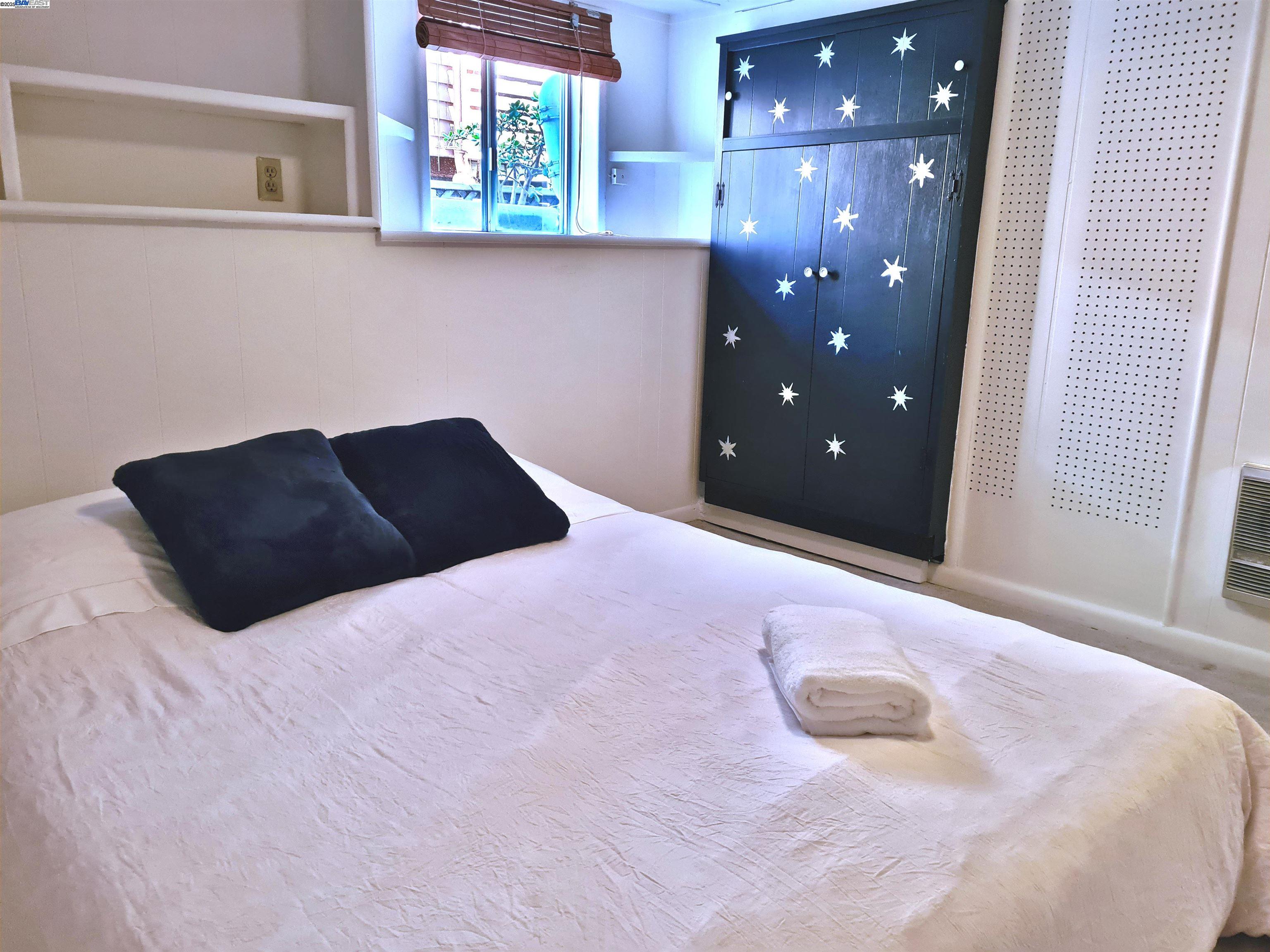 3103 Central Alameda, CA 94501 - Photo 37 of 50 a bedroom with a bed and a window