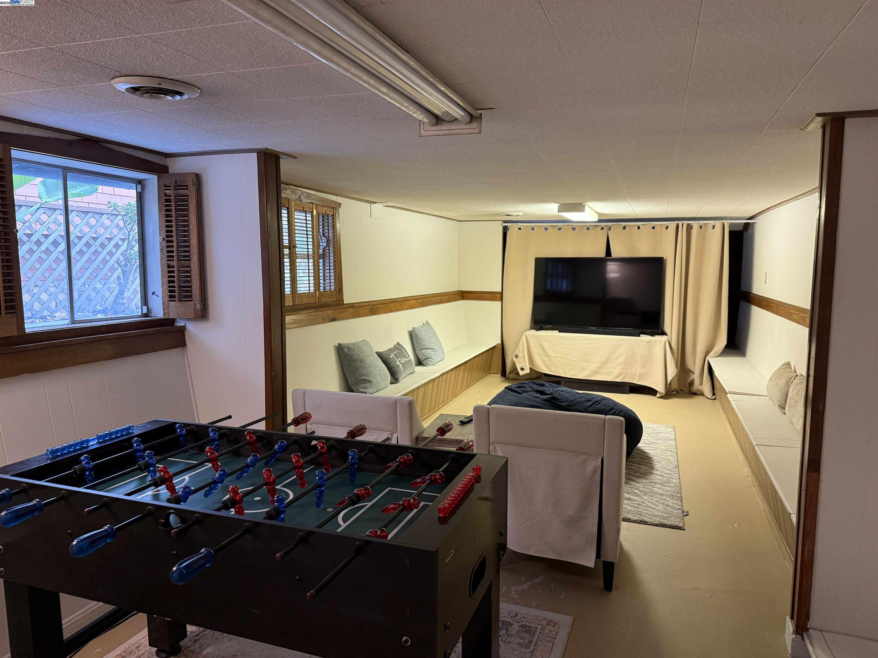 3103 Central Alameda, CA 94501 - Photo 38 of 50 a living room with furniture and a flat screen tv