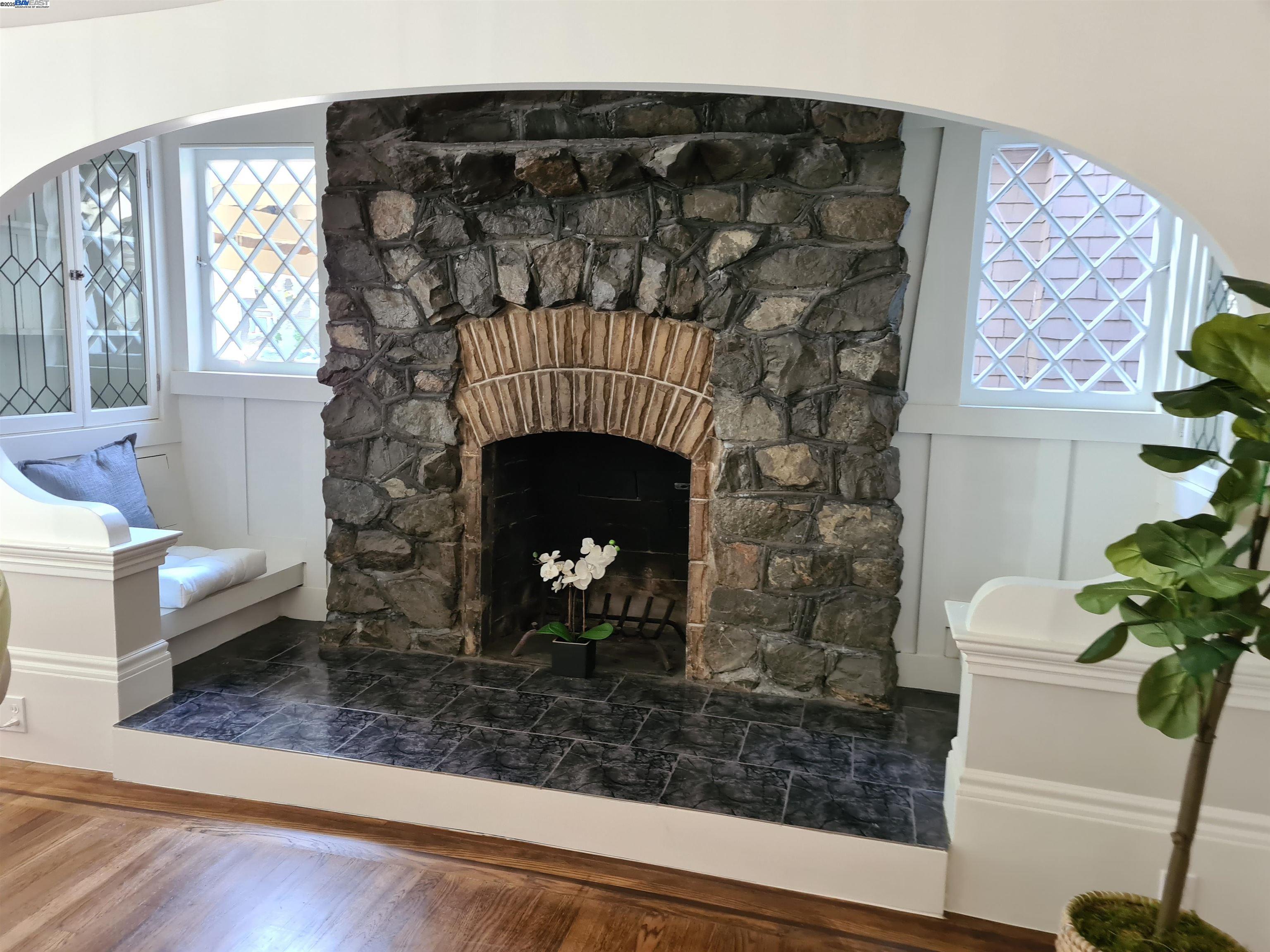 3103 Central Alameda, CA 94501 - Photo 9 of 50 a living room with a fireplace and a potted plant