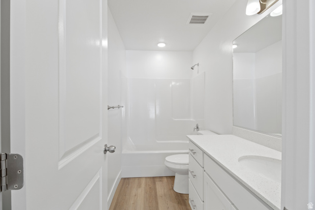 1262 West 500 South Logan, UT 84321 - Photo 17 of 39 Bathroom featuring a white vanity with a light-colored countertop, an integrated sink, and brushed nickel hardware