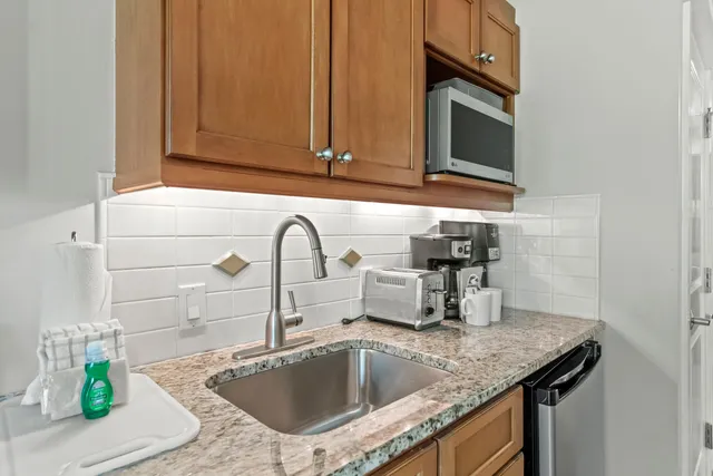 a bedroom with bed and wall painting