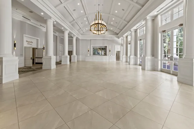 a view of a chairs and deck in the backyard