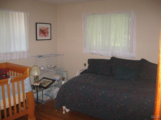 5103 High Terrace Road Stroudsburg, PA 18360 - Photo 11 of 20 a bed sitting in a bedroom next to a window