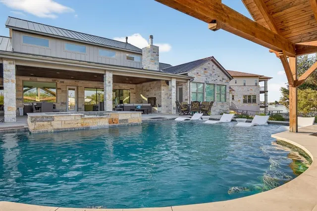 a swimming pool with outdoor seating