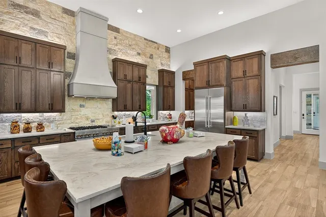 a kitchen with a dining table and chairs