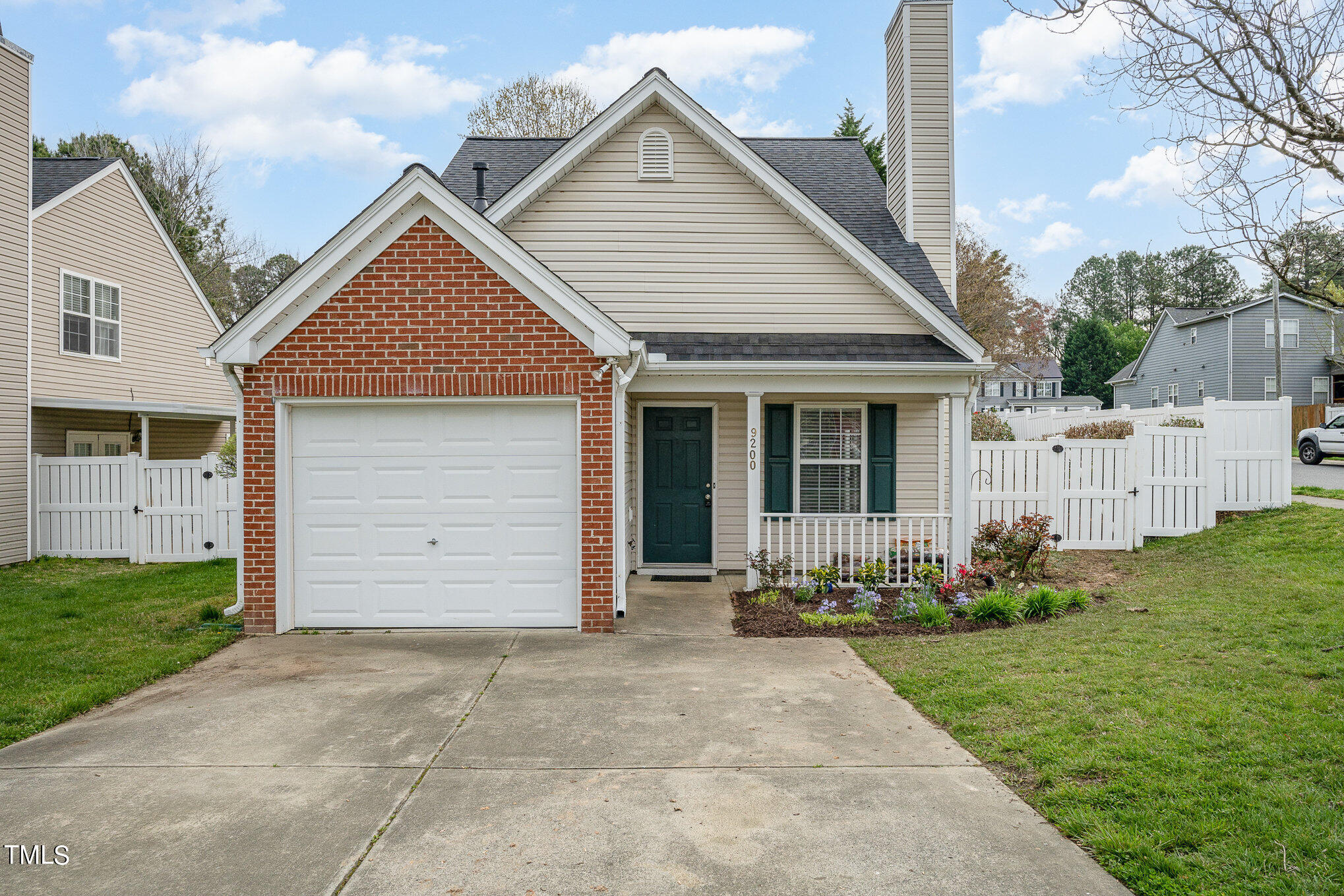9200 Shallcross Way Raleigh, NC 27617 - Photo 1 of 24 a front view of a house with garden