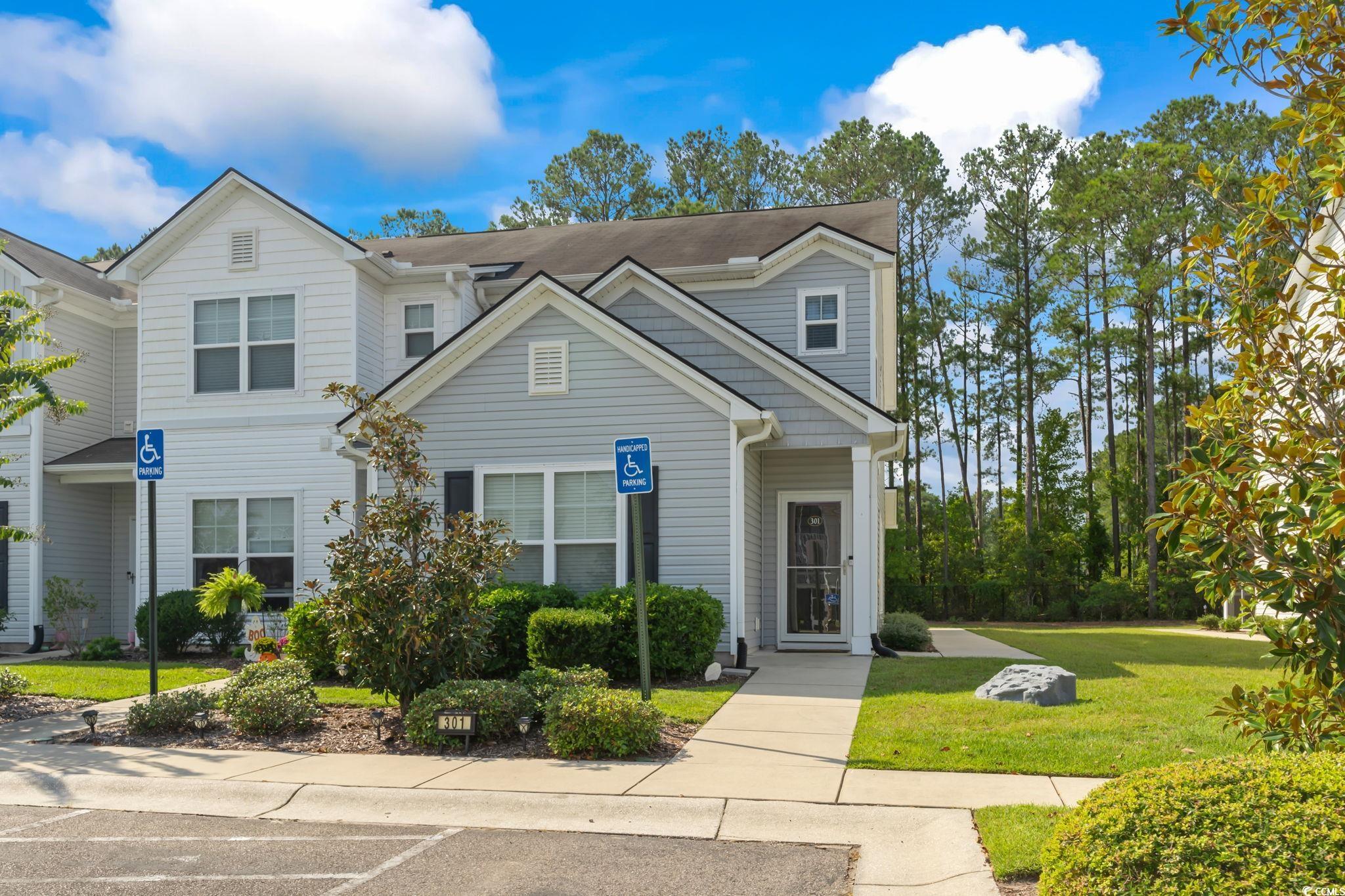 301 Castle Drive, Unit 301 Myrtle Beach, SC 29579 - Photo 1 of 30 View of front of property with a front lawn