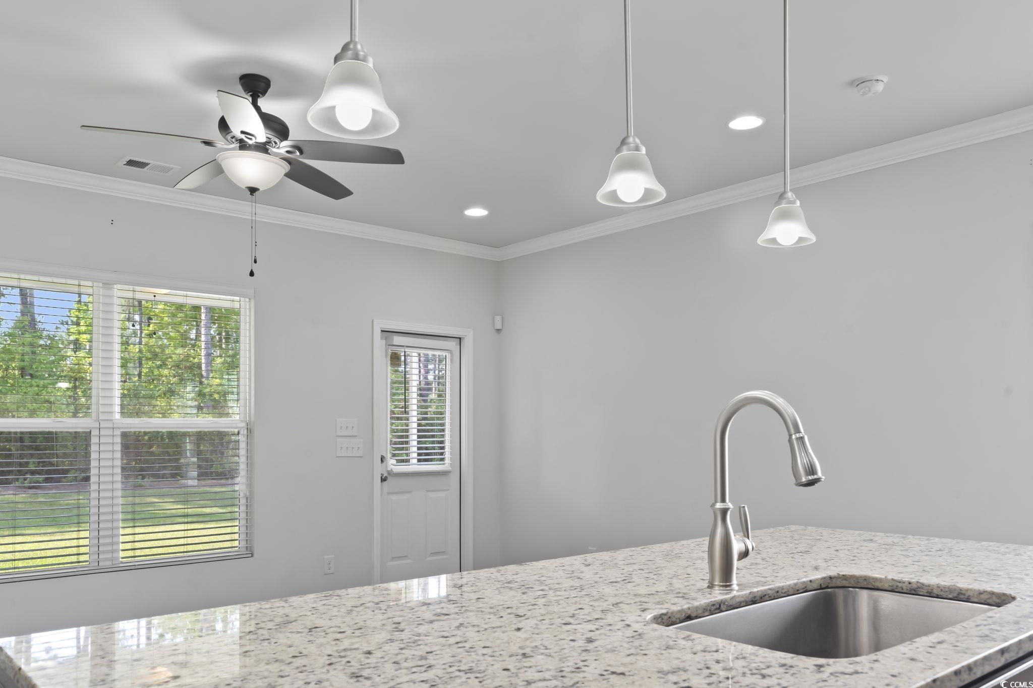301 Castle Drive, Unit 301 Myrtle Beach, SC 29579 - Photo 15 of 30 Kitchen with ornamental molding, light stone count