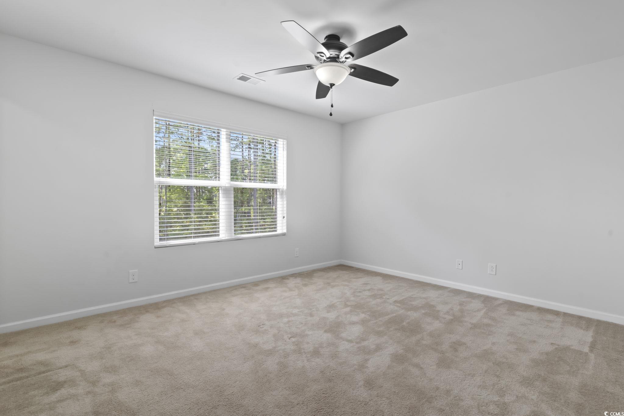 301 Castle Drive, Unit 301 Myrtle Beach, SC 29579 - Photo 23 of 30 Empty room featuring light colored carpet and ceil