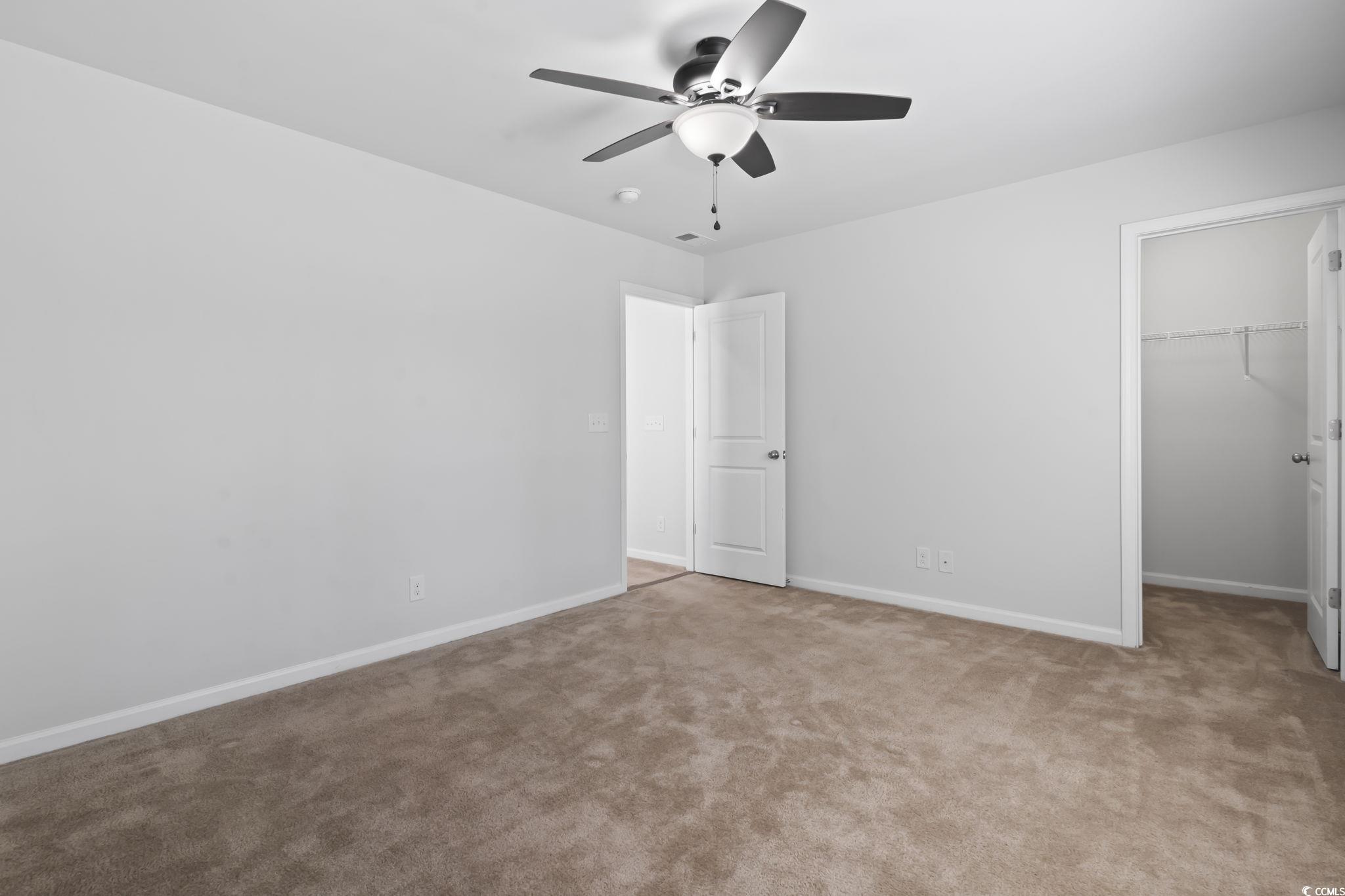 301 Castle Drive, Unit 301 Myrtle Beach, SC 29579 - Photo 24 of 30 Unfurnished bedroom featuring ceiling fan, light c