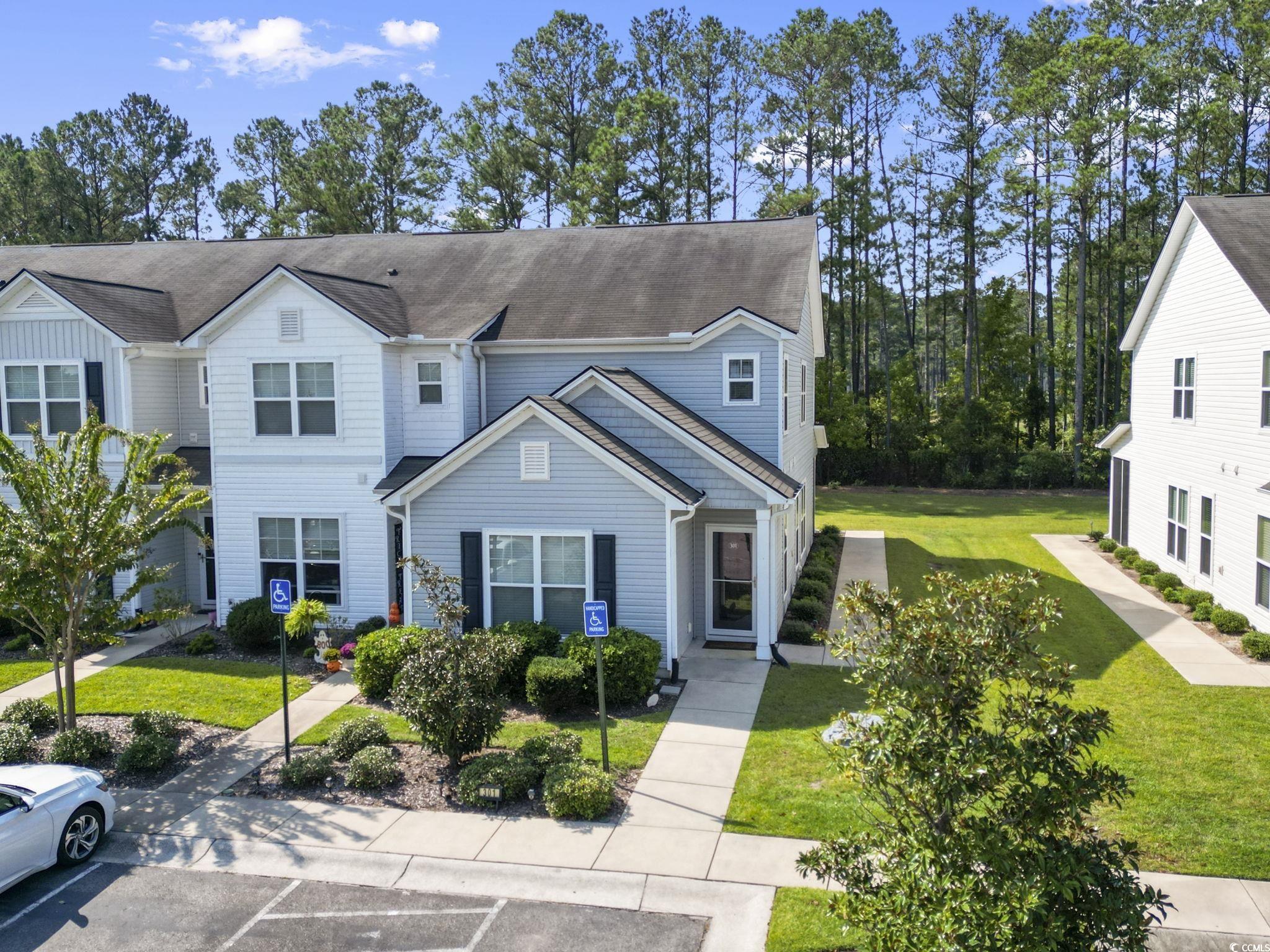301 Castle Drive, Unit 301 Myrtle Beach, SC 29579 - Photo 27 of 30 Multi unit property featuring a front yard