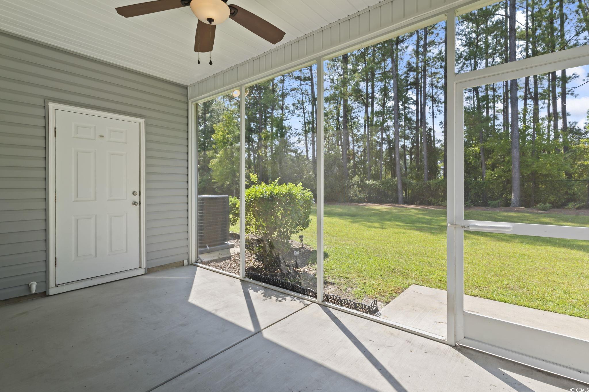301 Castle Drive, Unit 301 Myrtle Beach, SC 29579 - Photo 3 of 30 Unfurnished sunroom with ceiling fan