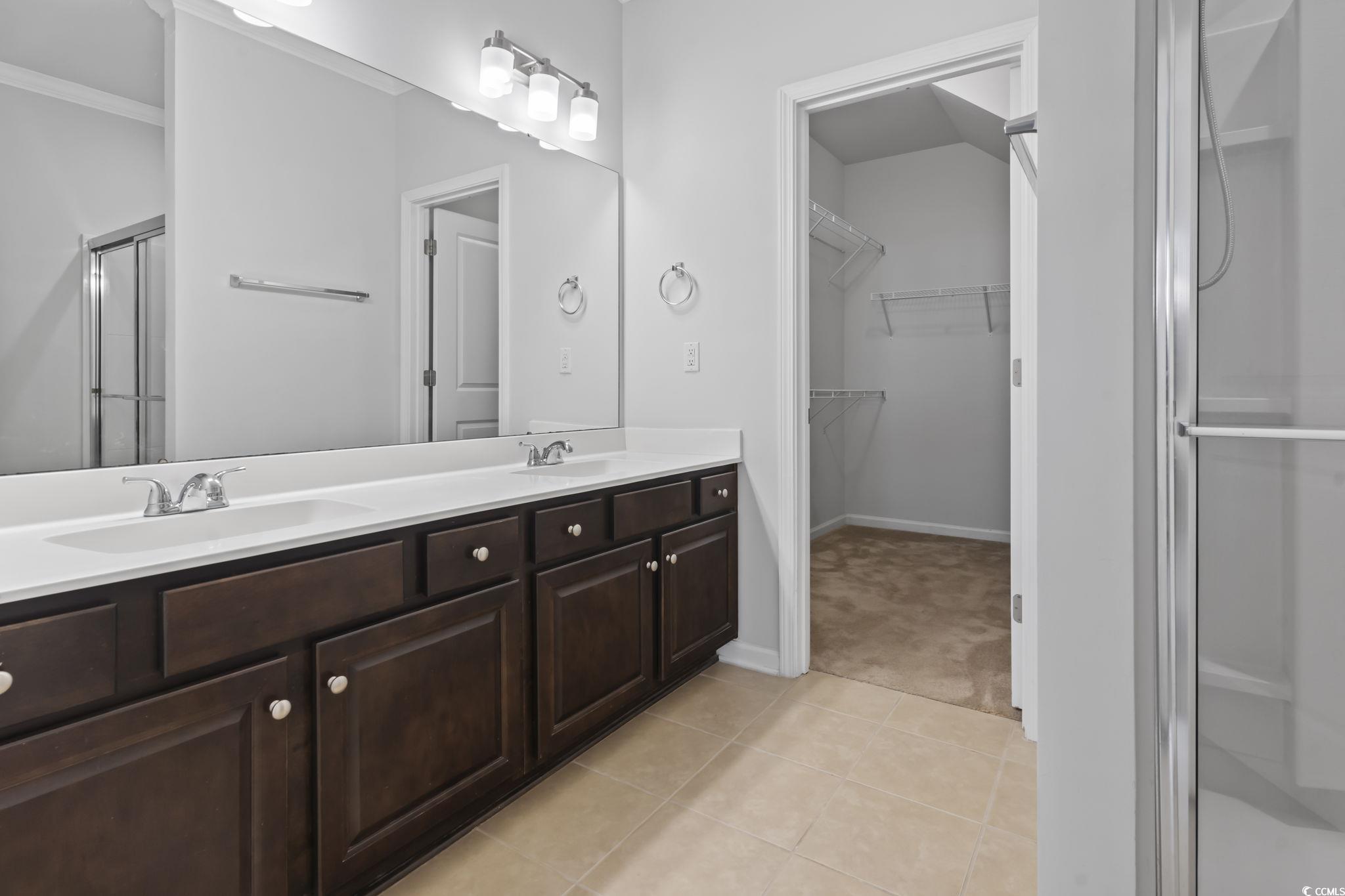 301 Castle Drive, Unit 301 Myrtle Beach, SC 29579 - Photo 8 of 30 Bathroom with an enclosed shower, tile patterned f