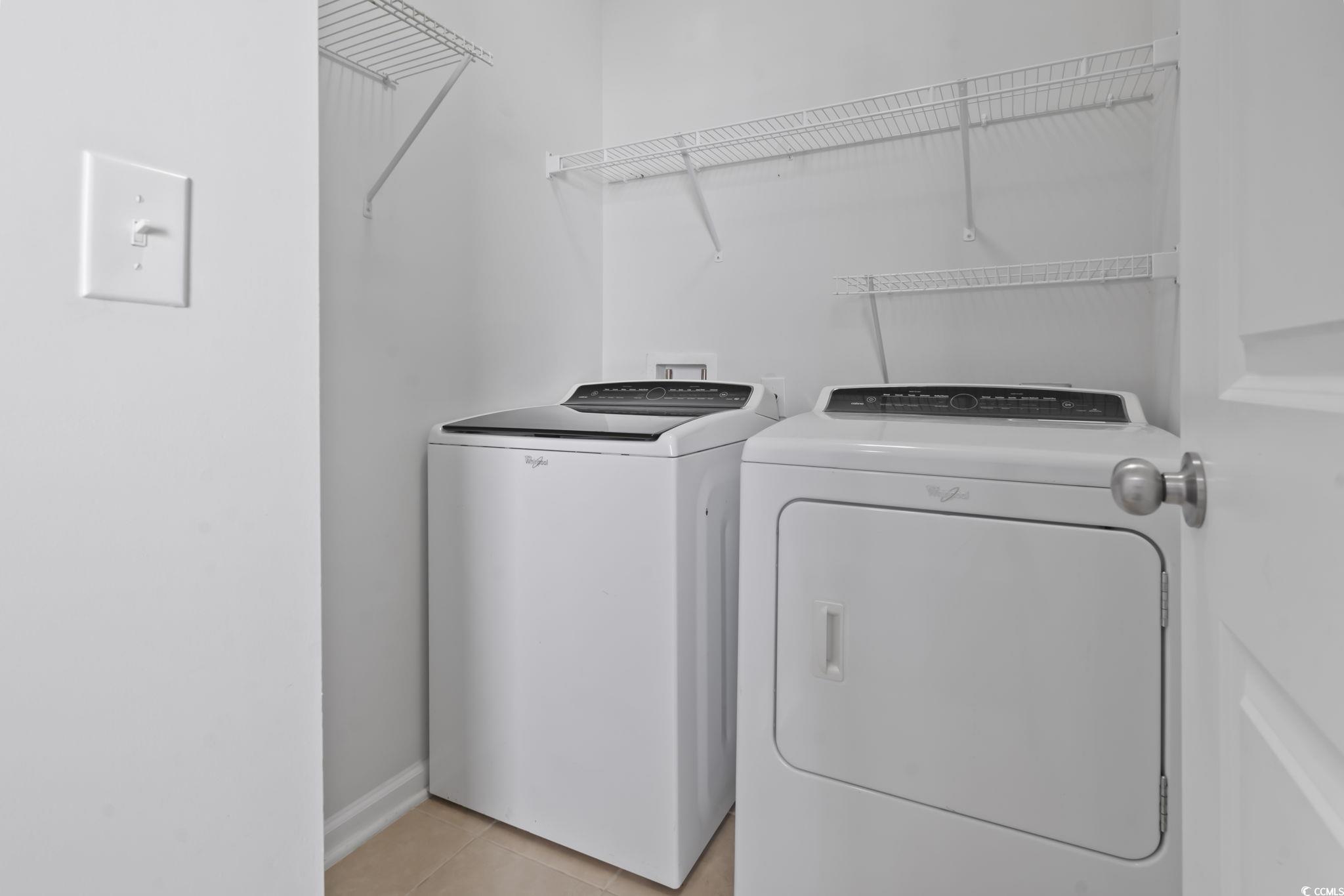 301 Castle Drive, Unit 301 Myrtle Beach, SC 29579 - Photo 10 of 30 Laundry area featuring washer and clothes dryer an