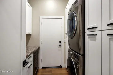 a view of a storage and utility room with washer and dryer