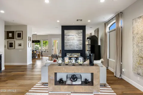 a kitchen with a refrigerator and a coffee table