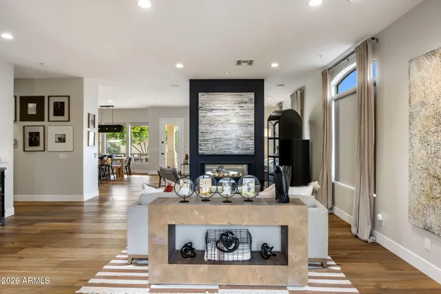 a kitchen with a refrigerator and a coffee table