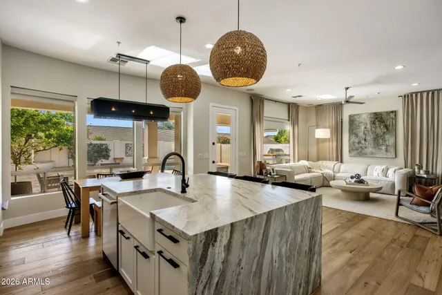 a large kitchen with a table and chairs