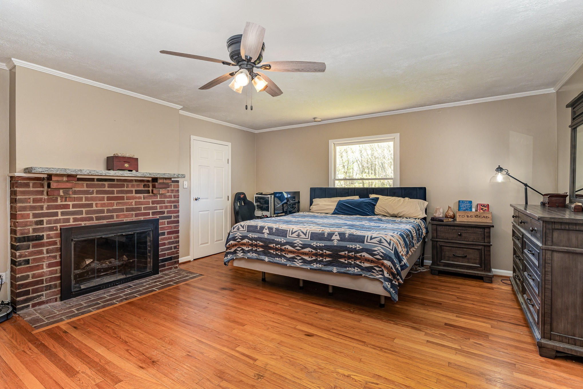 1029 Cumberland Heights Road Clarksville, TN 37040 - Photo 11 of 34 a bedroom with a bed and a fireplace