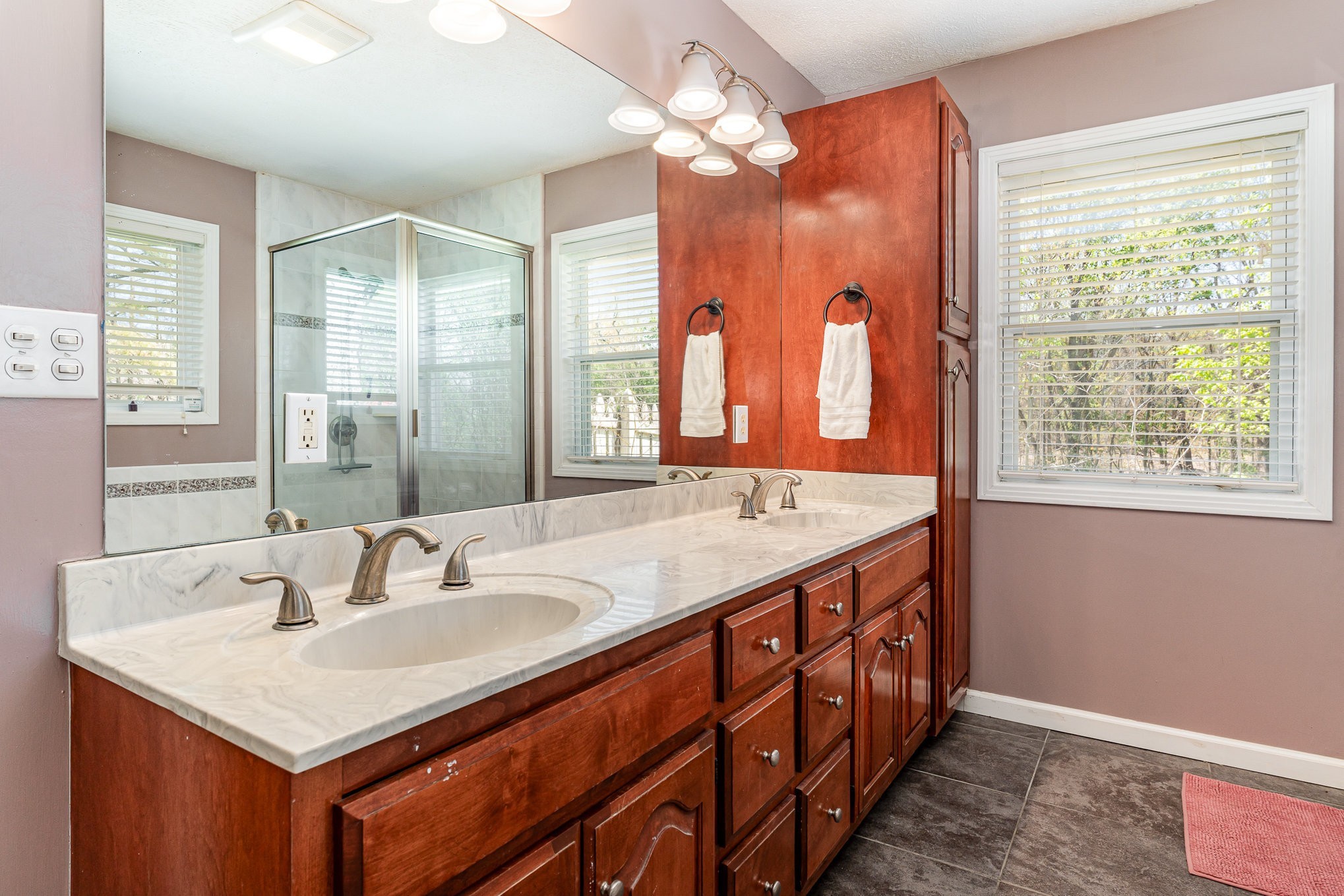 1029 Cumberland Heights Road Clarksville, TN 37040 - Photo 14 of 34 a bathroom with a sink double vanity and a mirror
