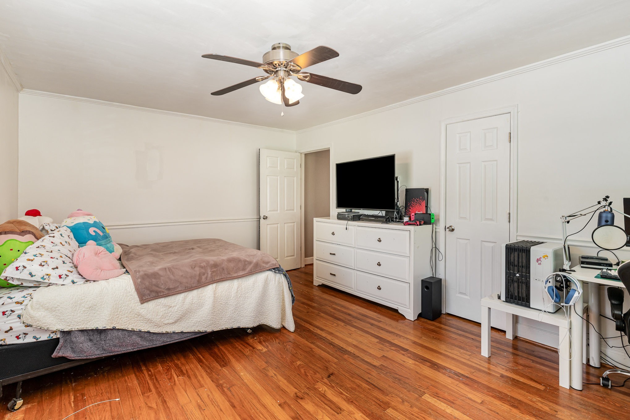 1029 Cumberland Heights Road Clarksville, TN 37040 - Photo 17 of 34 a bedroom with a bed and a flat screen tv