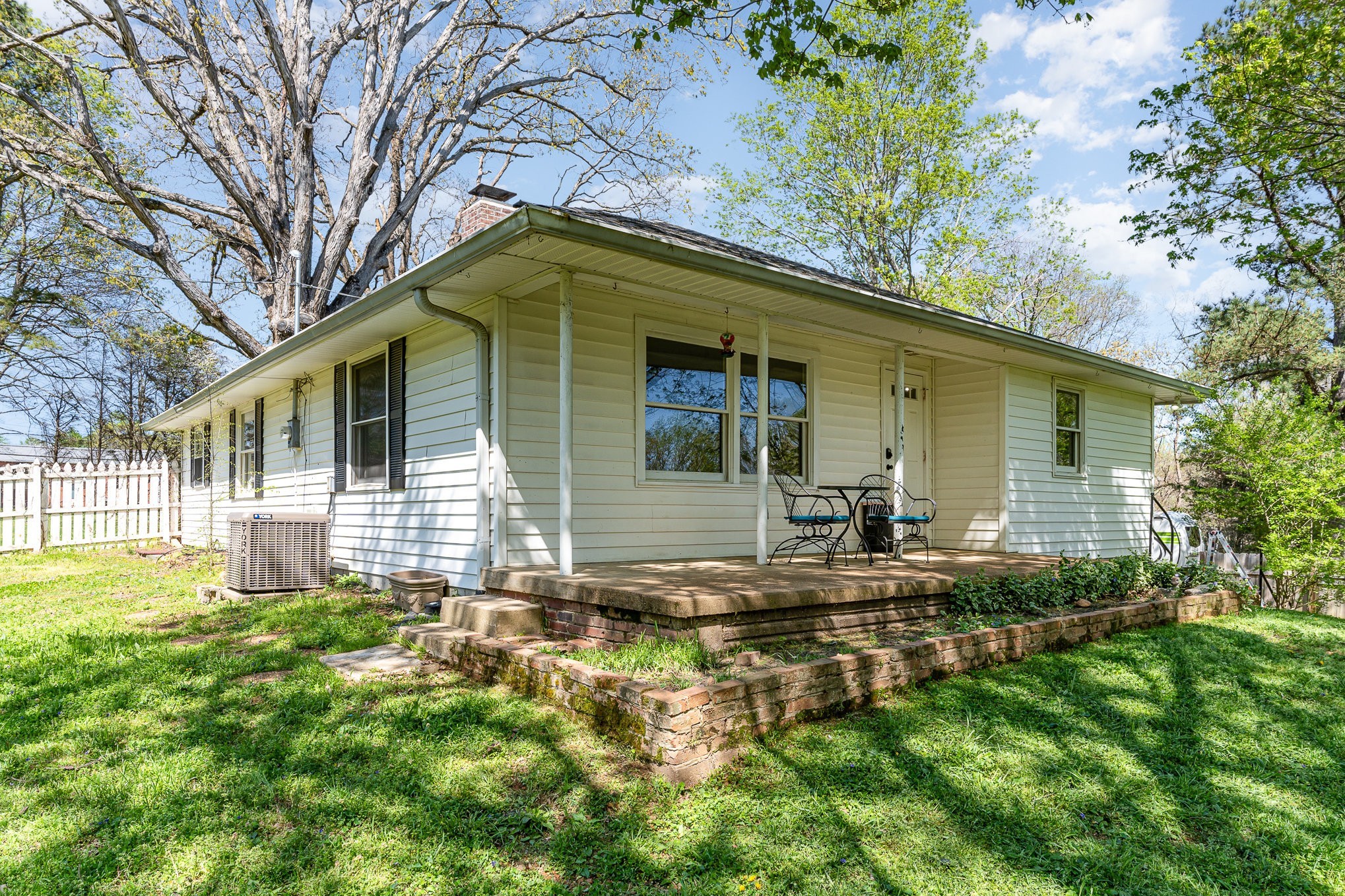 1029 Cumberland Heights Road Clarksville, TN 37040 - Photo 26 of 34 a backyard of a house with yard and outdoor seating