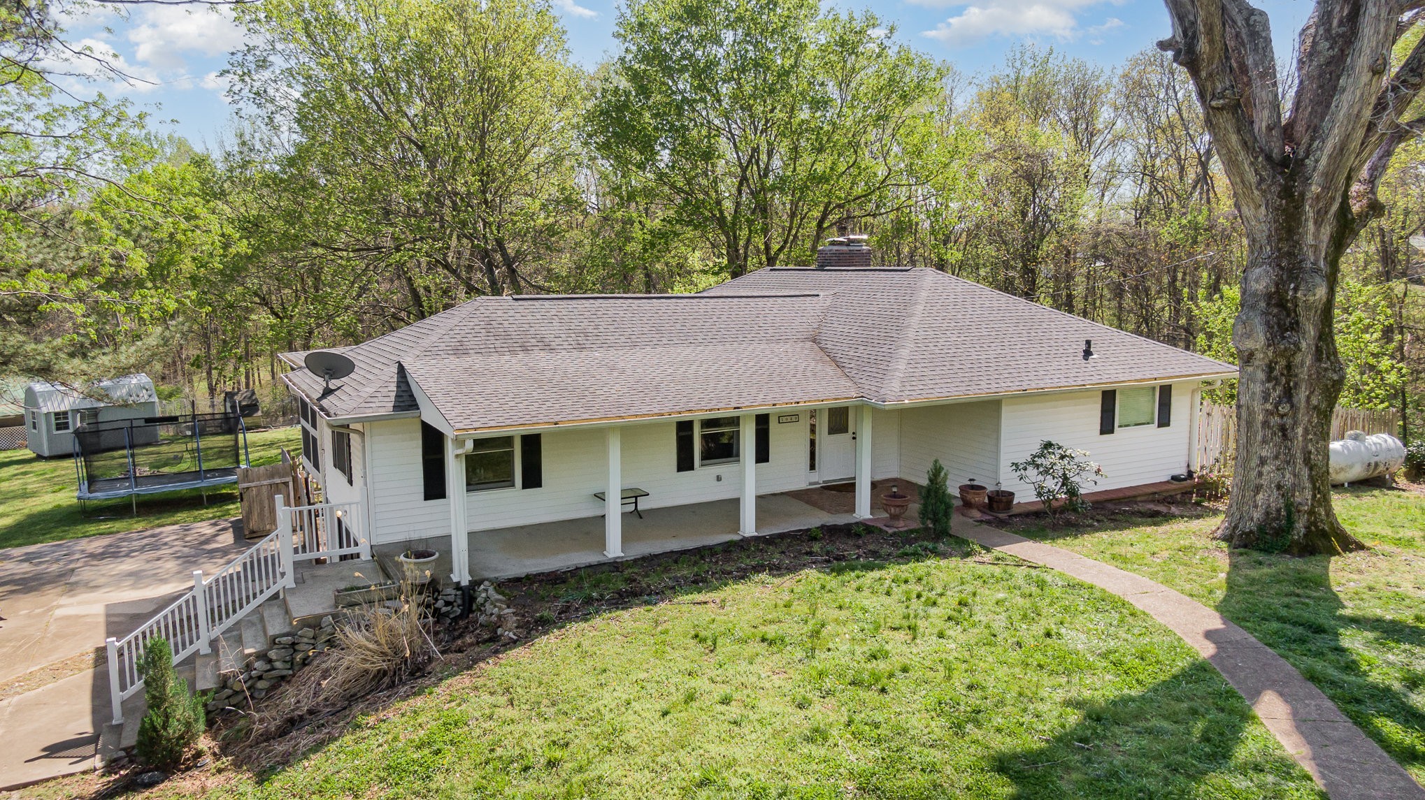 1029 Cumberland Heights Road Clarksville, TN 37040 - Photo 5 of 34 an aerial view of a house with a yard table and chairs