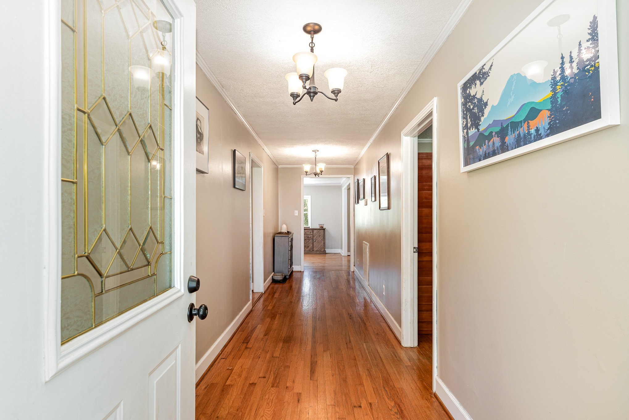 1029 Cumberland Heights Road Clarksville, TN 37040 - Photo 6 of 34 a view of a hallway with wooden floor and staircase