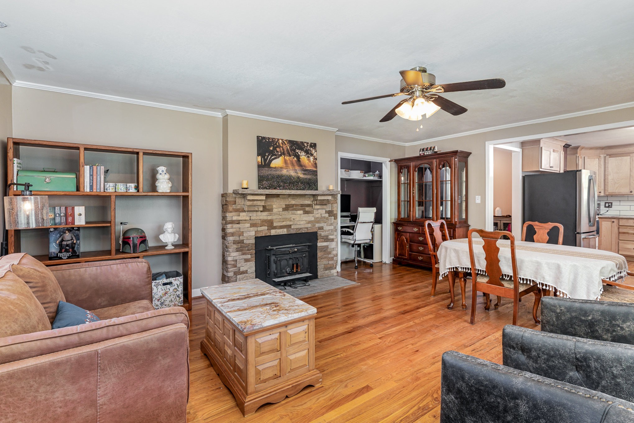 1029 Cumberland Heights Road Clarksville, TN 37040 - Photo 8 of 34 a living room with furniture a flat screen tv and a fireplace