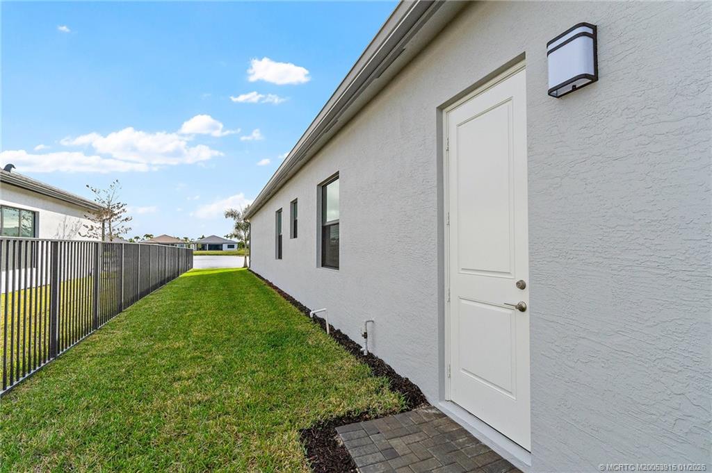 12159 Southwest Songbird Road Port St. Lucie, FL 34987 - Photo 4 of 29 Side yard with large easement