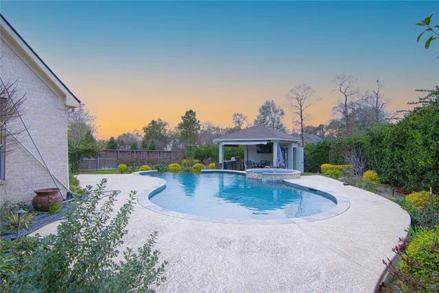 swimming pool view with a seating space