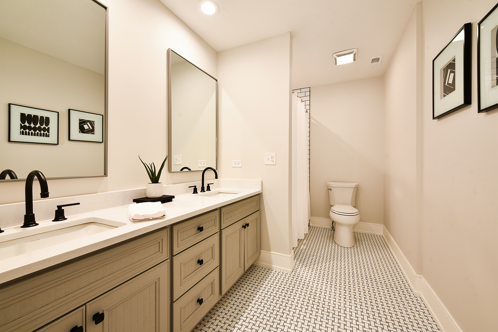688 Thompson's Way Inverness, IL 60067 - Photo 24 of 34 a bathroom with a double vanity sink a mirror and a toilet
