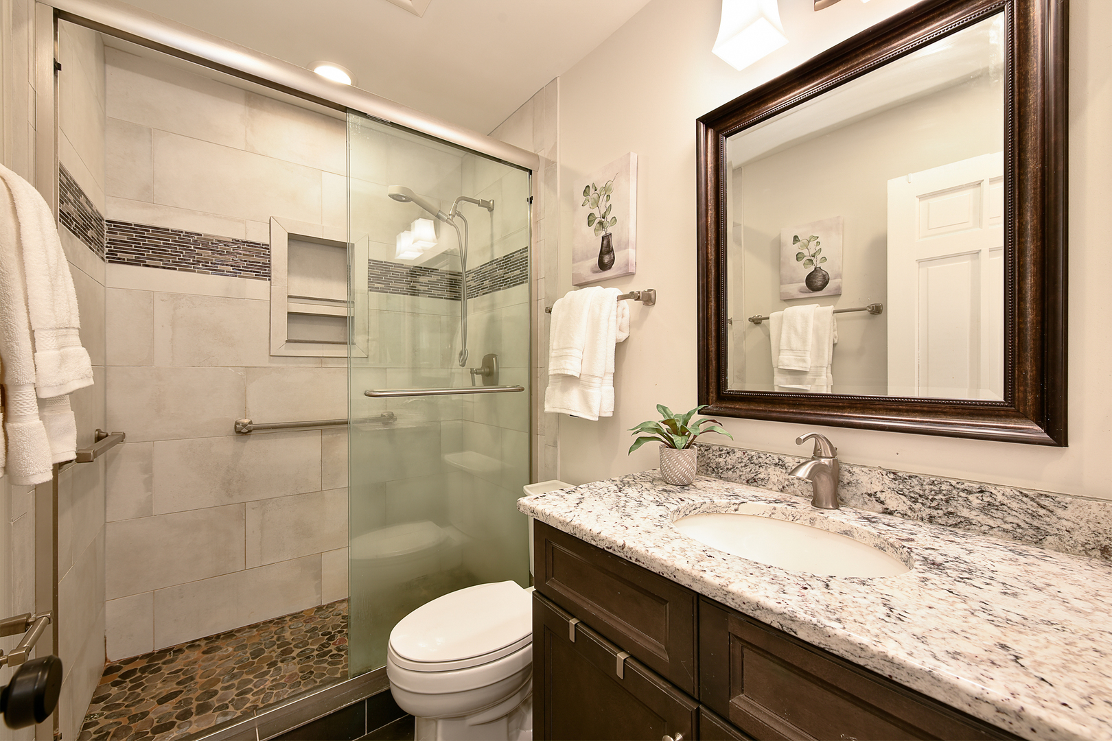 688 Thompson's Way Inverness, IL 60067 - Photo 29 of 34 a bathroom with a granite countertop sink a toilet and shower