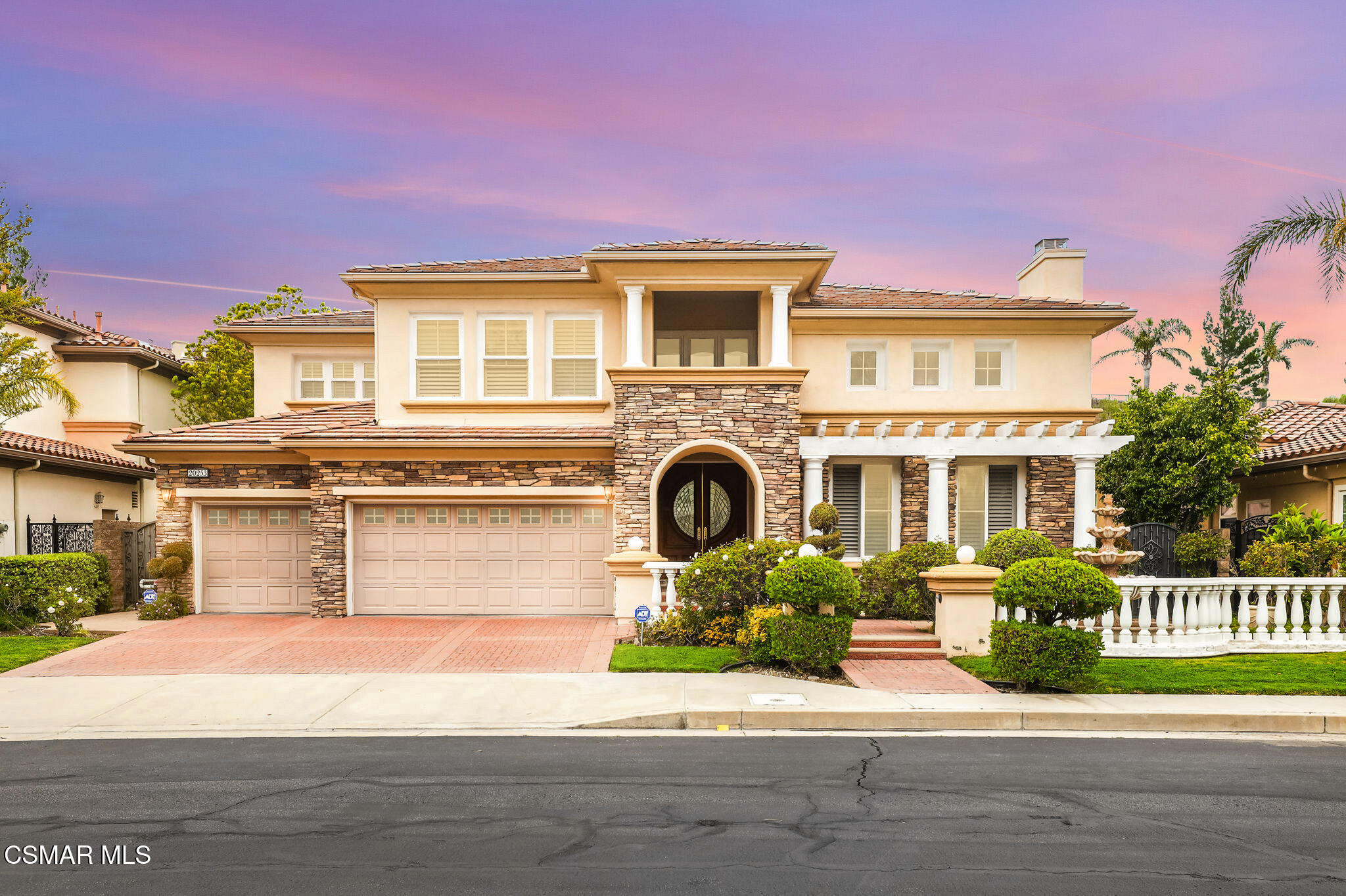 20253 Vía Galileo Porter Ranch, CA 91326 - Photo 1 of 41 a front view of a house with a garden