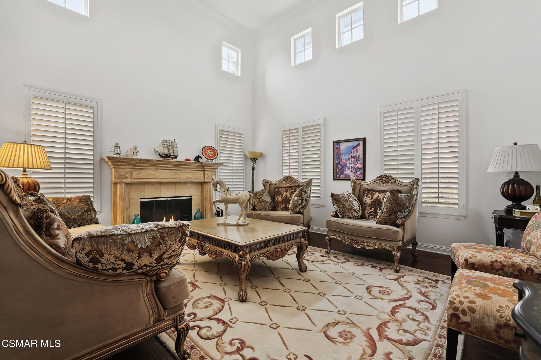 20253 Vía Galileo Porter Ranch, CA 91326 - Photo 14 of 41 a living room with furniture and a fireplace