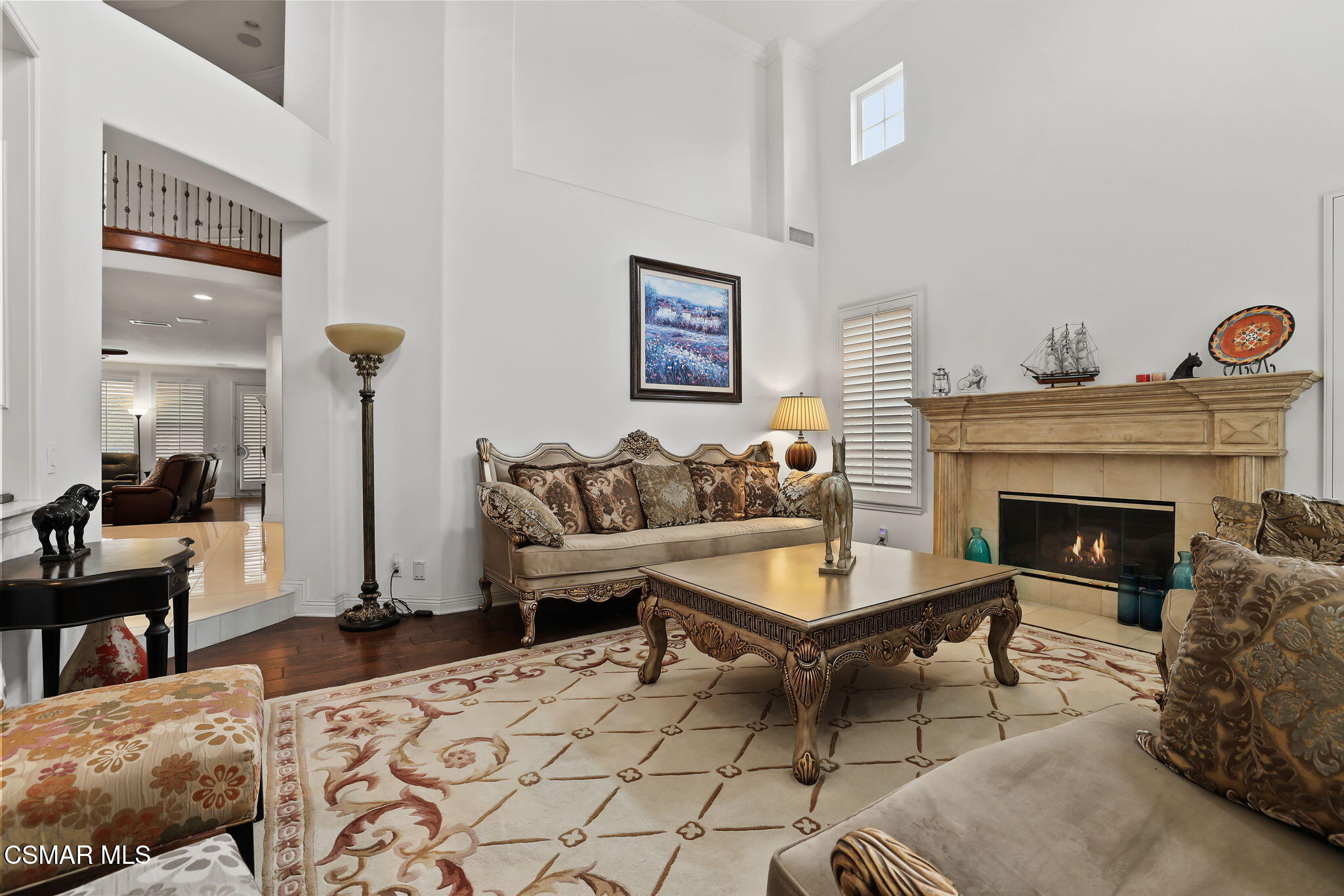 20253 Vía Galileo Porter Ranch, CA 91326 - Photo 15 of 41 a living room with furniture and a fireplace