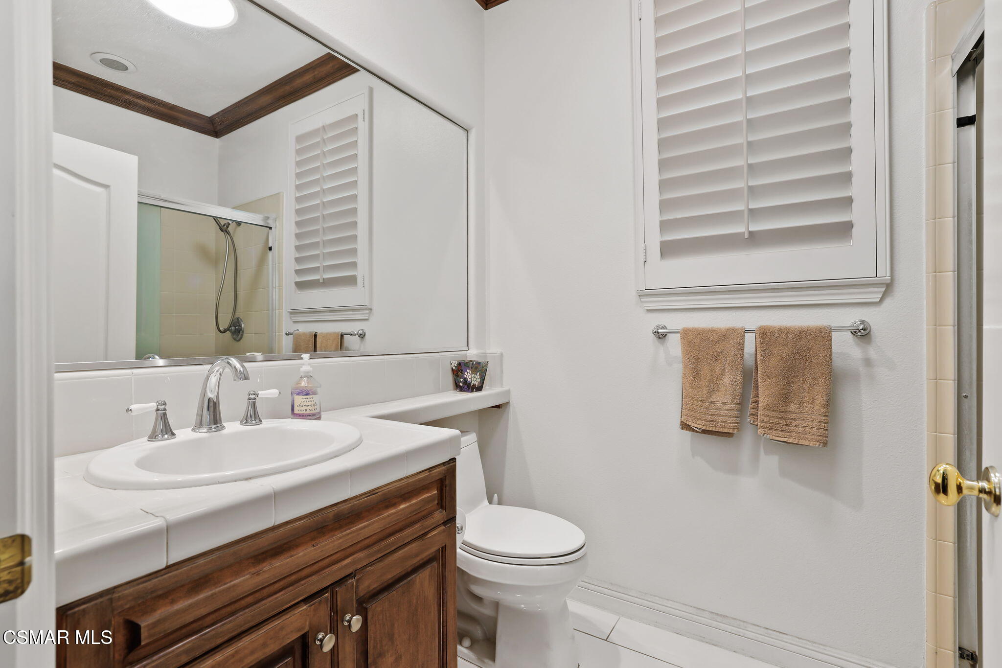 20253 Vía Galileo Porter Ranch, CA 91326 - Photo 19 of 41 a bathroom with a sink a toilet and mirror