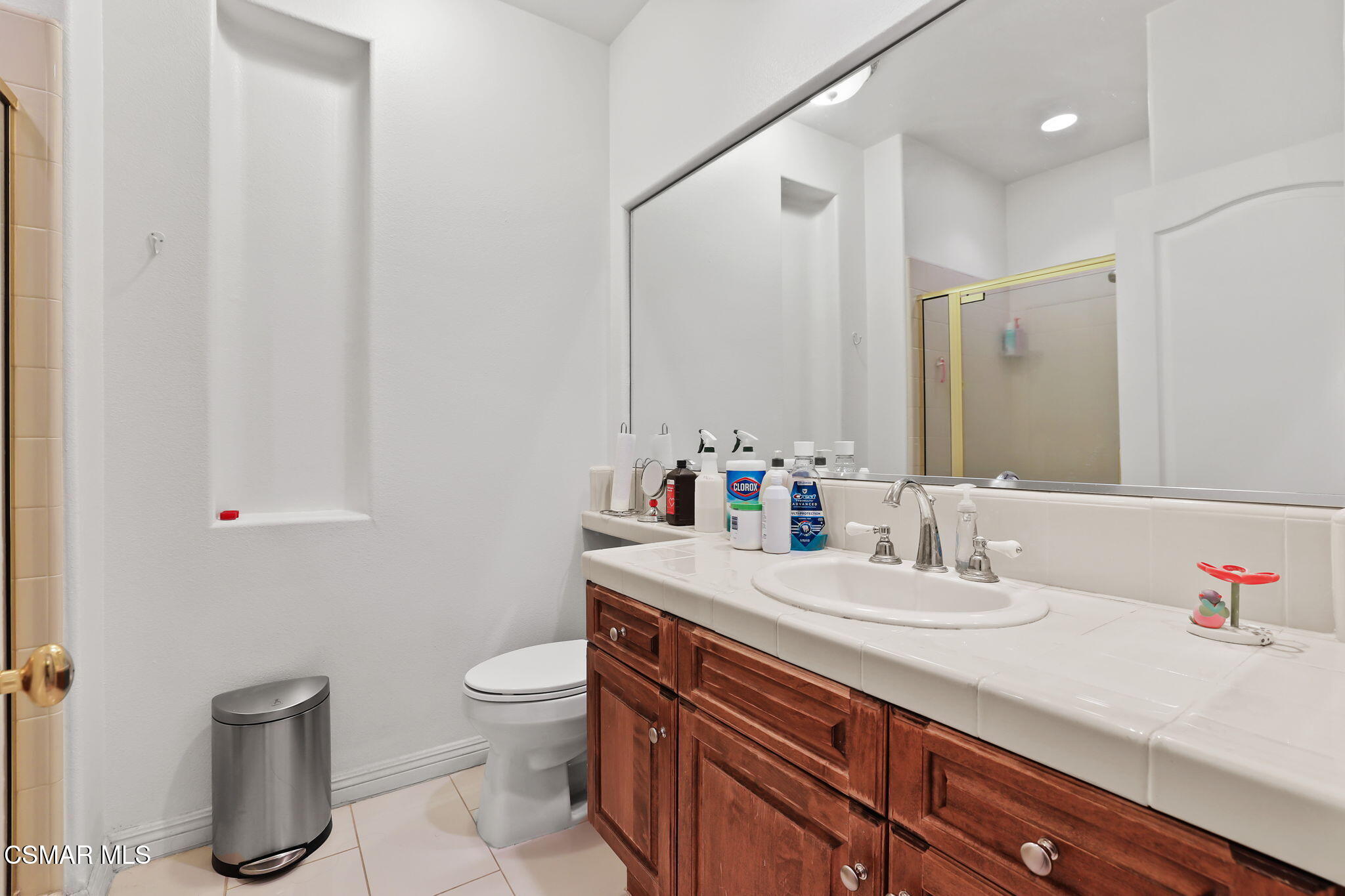 20253 Vía Galileo Porter Ranch, CA 91326 - Photo 27 of 41 a bathroom with a sink a toilet and a mirror