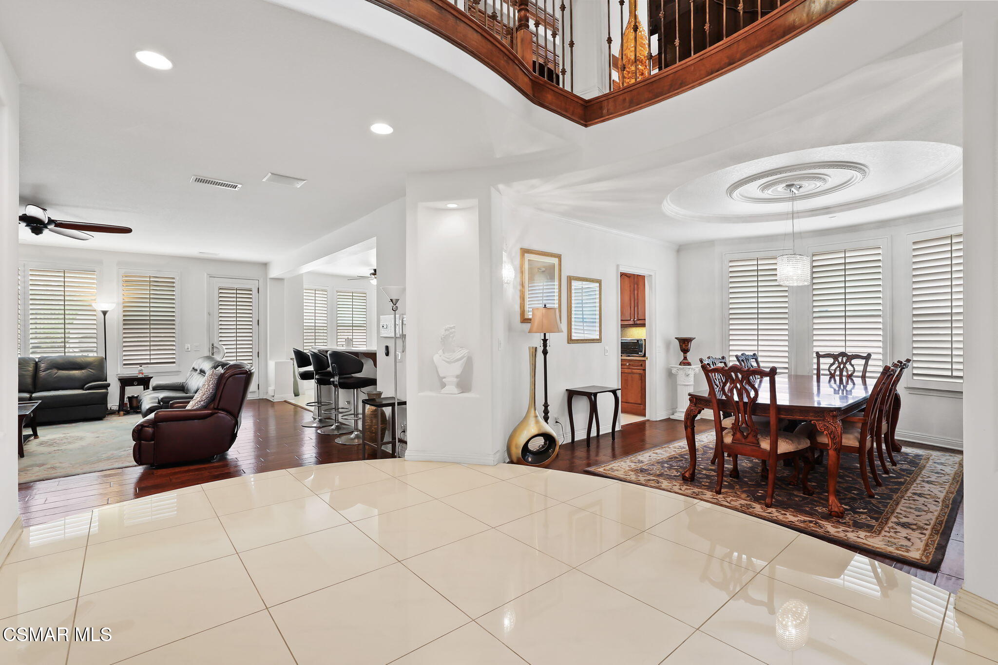 20253 Vía Galileo Porter Ranch, CA 91326 - Photo 3 of 41 a living room with furniture a dining table and chairs with the view of living room