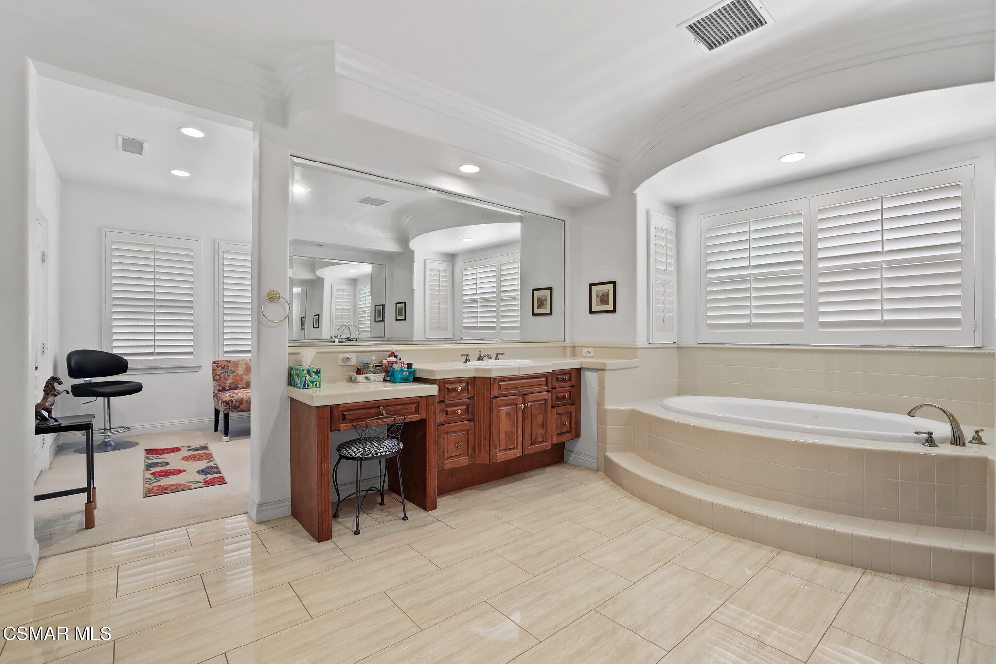 20253 Vía Galileo Porter Ranch, CA 91326 - Photo 31 of 41 a spacious bathroom with a tub sink and mirror