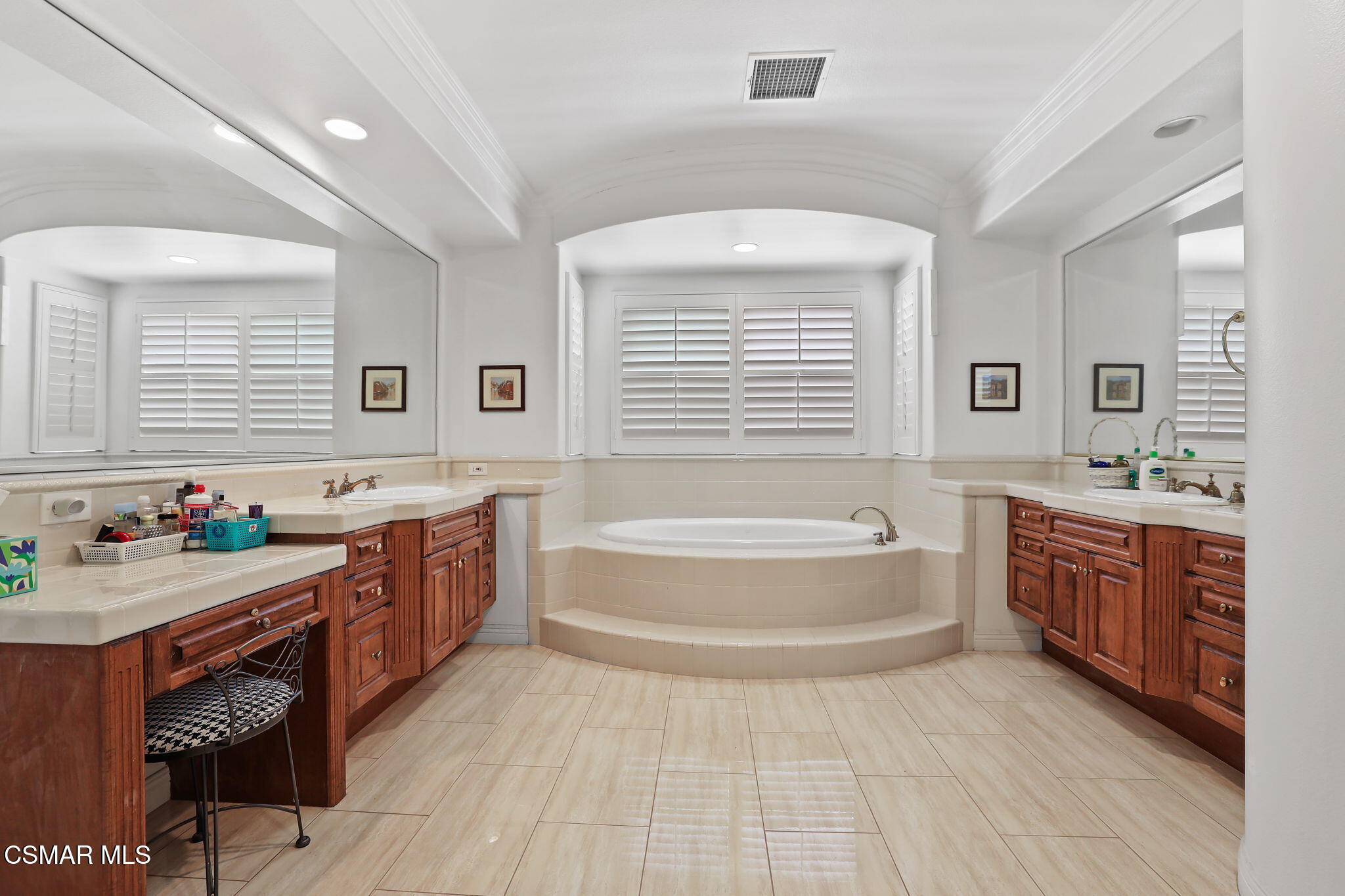 20253 Vía Galileo Porter Ranch, CA 91326 - Photo 32 of 41 a spacious bathroom with a tub double sink and a window