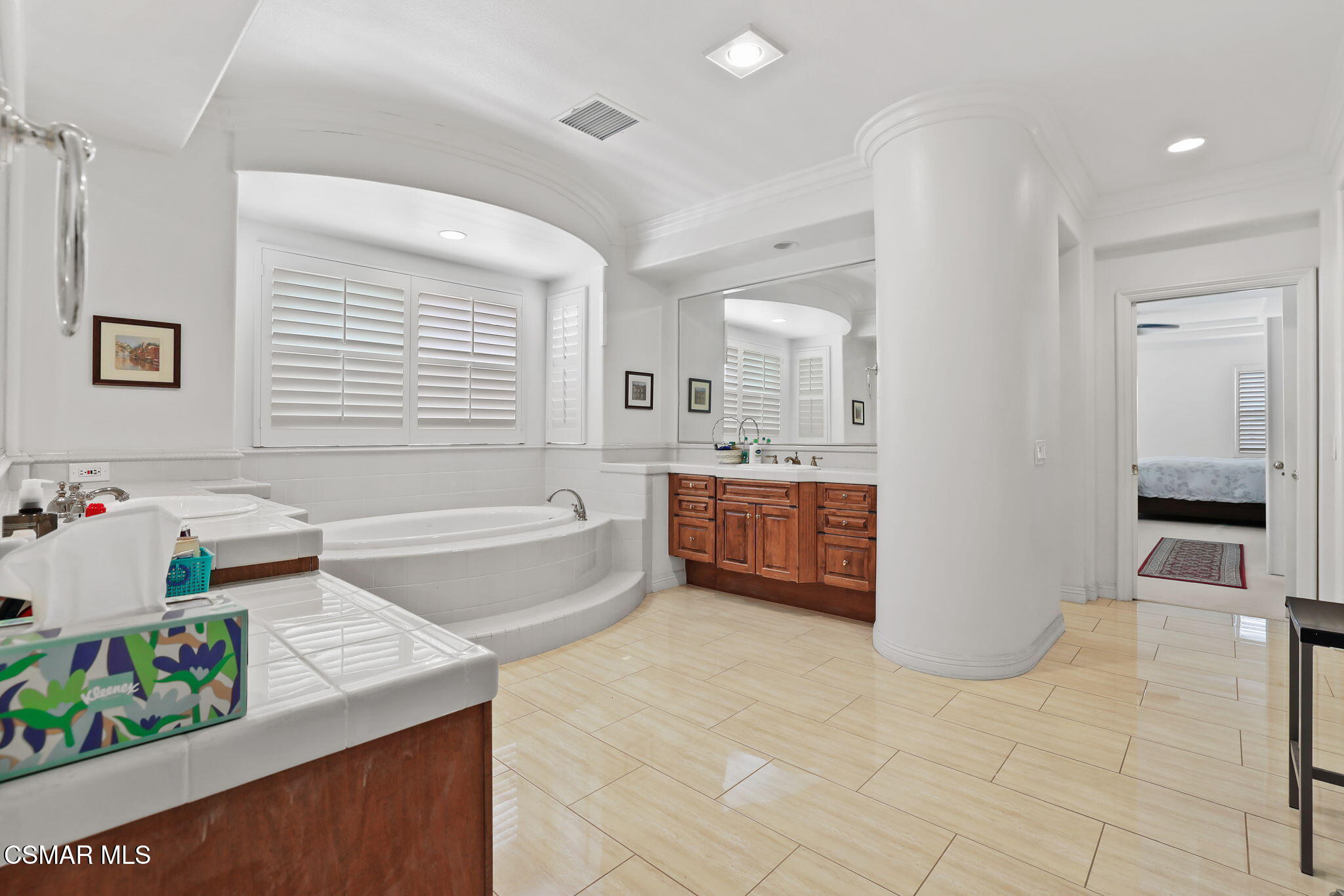 20253 Vía Galileo Porter Ranch, CA 91326 - Photo 33 of 41 a spacious bathroom with a tub sink and mirror